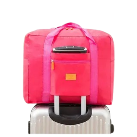 Дорожная складная сумка розовая на чемодане