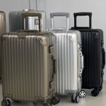 Чемодан ALUM серый, золотой и черный. с поднятыми ручками