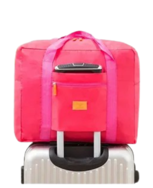 Дорожная складная сумка розовая на чемодане